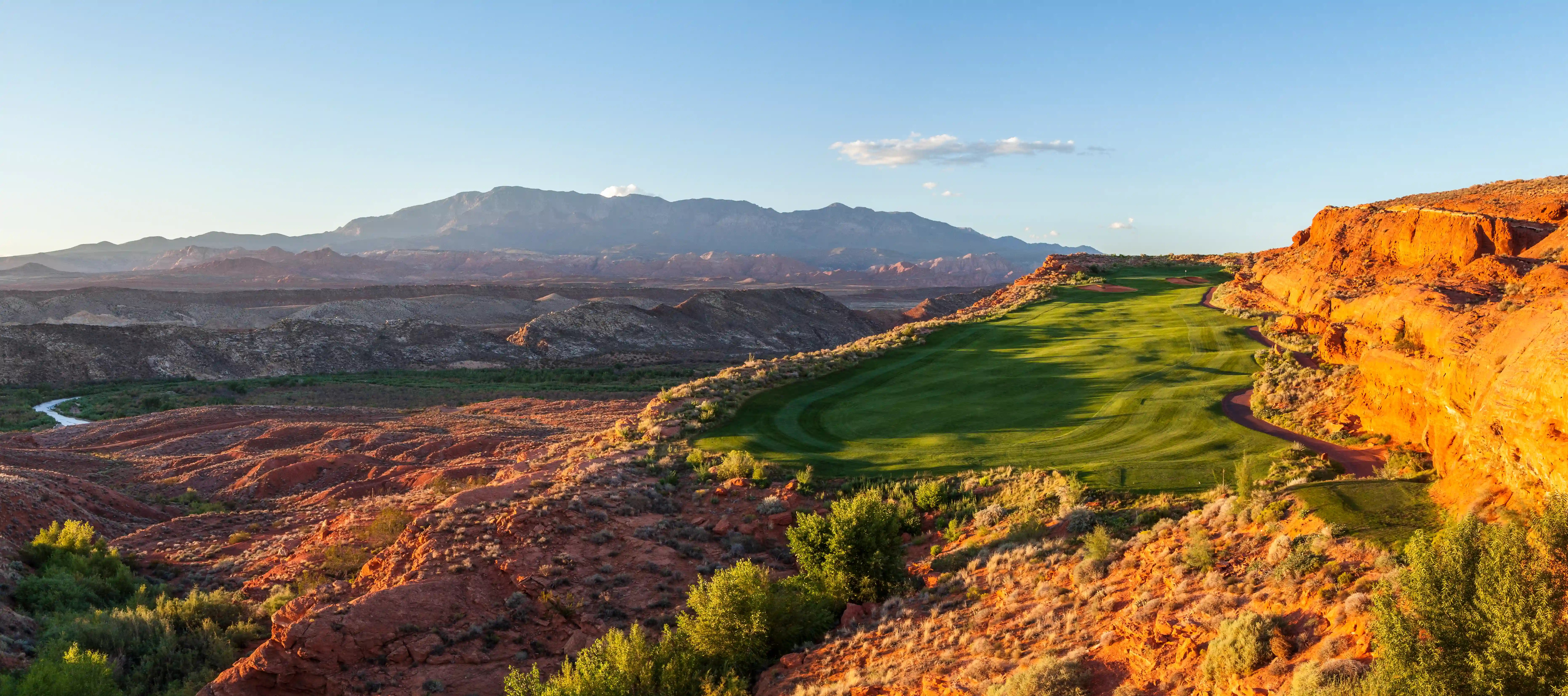 Golf course winding through a red-rock landscape